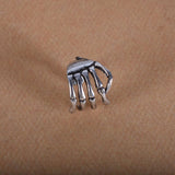 Skull hand ear clip