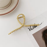 Hollow metal hair claw