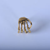 Skull hand ear clip