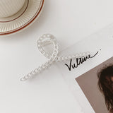 Hollow metal hair claw