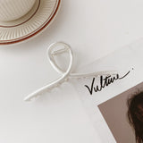 Hollow metal hair claw