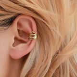 Skull hand ear clip
