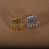 Skull hand ear clip
